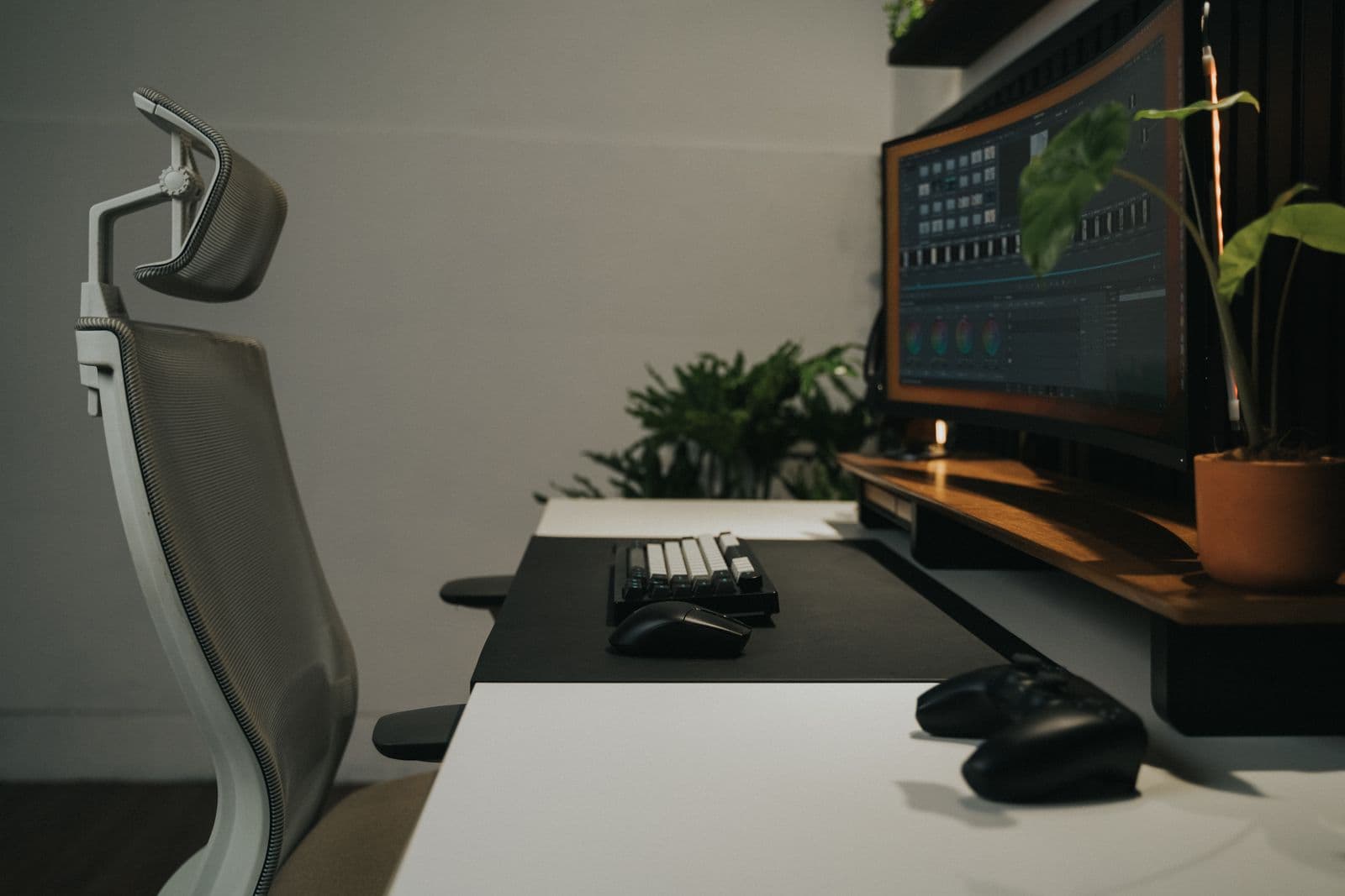 A modern home office workspace with an ergonomic chair and dual monitors