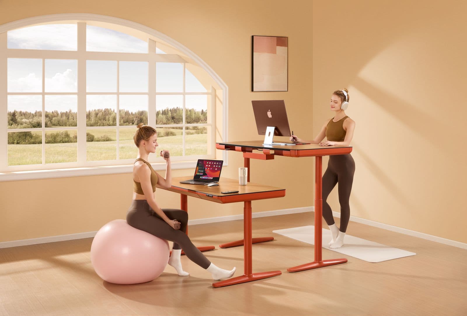 A modern home office with a height-adjustable desk frame beside a window